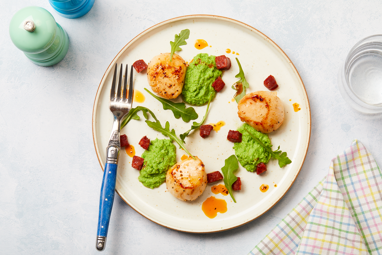 A photograph of Scallops with chorizo  